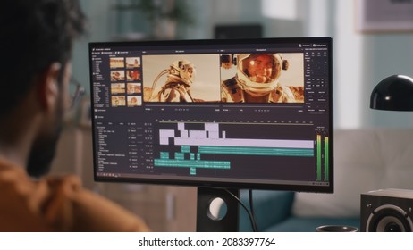 Unrecognizable guy editing astronaut video - Shutterstock ID 2083397764