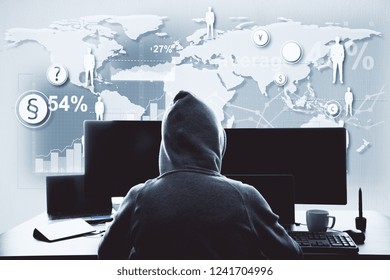 Unrecognizable hacker using computer with digital business interface. Hacking and information concept