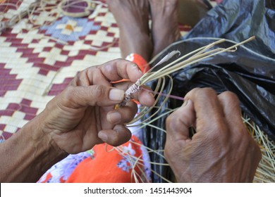 An Unrecognizable Indigenous Australian Aboriginal Woman Basket Weaving In Arnhem Land In The Northern Territory Of Australia