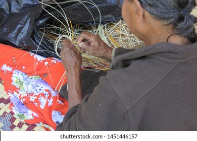 An Unrecognizable Indigenous Australian Aboriginal Woman Basket Weaving In Arnhem Land In The Northern Territory Of Australia