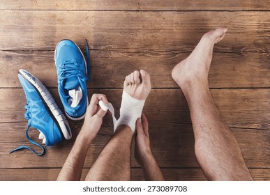 Unerkennbarer verletzter Läufer auf Holzhintergrund