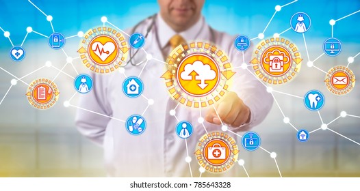 Unrecognizable Male Doctor Of Medicine Is Synchronizing Data Via A Software As A Service Application Interface. Healthcare IT Concept For Medical Practice Management And Health Information Exchange.