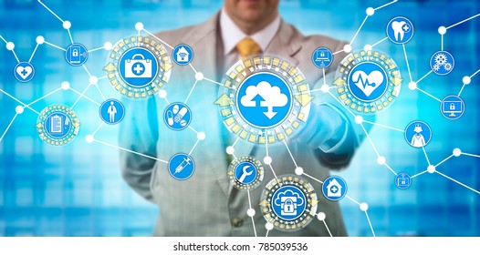 Unrecognizable Male Health Care Administrator Is Transferring Data Via Software As A Service Application. Healthcare IT Concept For Medical Practice Management System And Health Information Exchange.