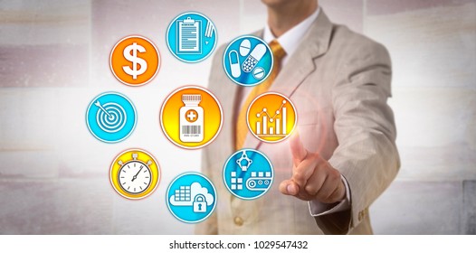 Unrecognizable Male Pharmaceutical Manufacturing Executive Setting A Price Strategy For A Therapeutic Product. Concept For Value Based Pricing, Value Based Payment And Near Real Time Data Capture.