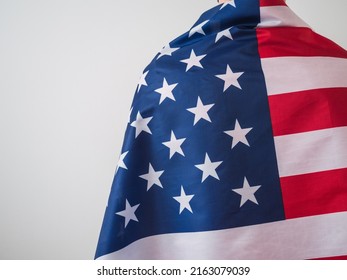 Unrecognizable Man From Behind, Hugging The Flag Of The United States And With Copy Space. Ready For The 4th Of July Celebration