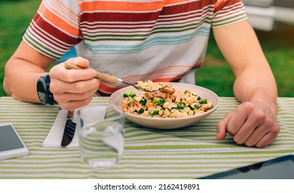 Unrecognizable Man Eating Vegan Food Outdoors