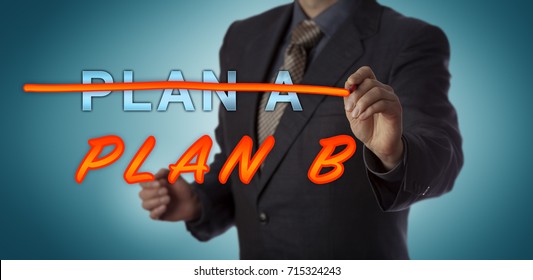 Unrecognizable Manager Crossing Out PLAN A With A Felt Tip Pen To Replace It With PLAN B. Business Concept For Contingency Planning, Alternative, Emergency Preparedness, Backup And Risk Management.