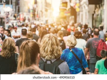 Unrecognizable Mass Of People Walking In The City