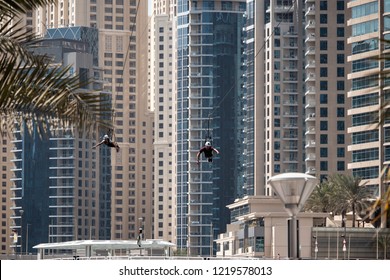 Unrecognizable People Having Fun With The Zip Line In Dubai, UAE.