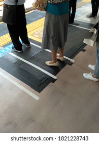 Unrecognizable People Queuing Up For Public Transportation