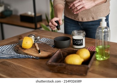 Unrecognizable Person Adding Essential Oil To The Bowl With DIY Cleaning Product