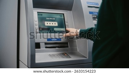Unrecognizable Person Entering PIN Code on ATM Keypad to Withdraw Money. Error Message on Cash Machine Display About Transaction Cancellation Due to Lost Connection. Banking Equipment. Close Up Shot.