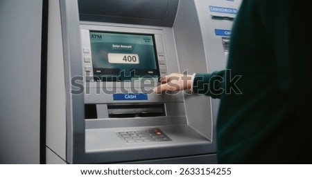 Unrecognizable Person Entering PIN Code on ATM Keypad to Withdraw Money. Error Message on Cash Machine Display About Transaction Cancellation Due to Lost Connection. Banking Equipment. Close Up Shot.
