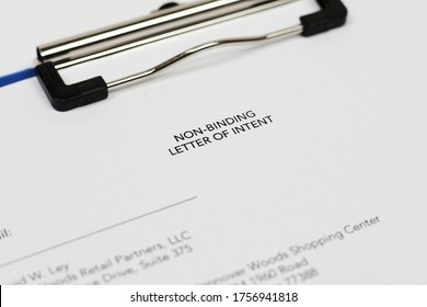 An unrecognizable person filling non-binding letter of intent. Close-up view - Shutterstock ID 1756941818