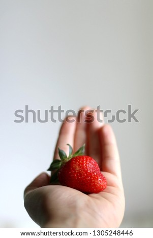 Similar – Woman holds strawberries in her hands