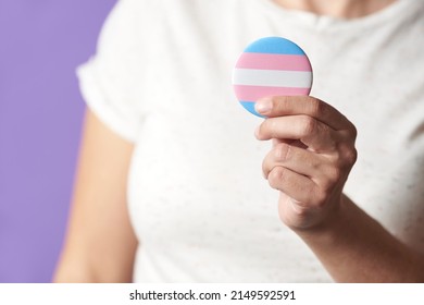 Unrecognizable Person Holding A Trans Flag Badge Or Pin. Concepts Of Identity Pride, Gender Diversity, Equality And Non Discrimination.