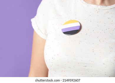 Unrecognizable Person With A Non Binary Flag Badge Or Pin. Concepts Of Identity Pride, Gender Diversity, Equality And Non Discrimination.