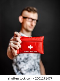 Unrecognizable person shows first aid kit closeup