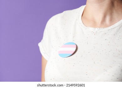 Unrecognizable Person With A Trans Flag Badge Or Pin. Concepts Of Identity Pride, Gender Diversity, Equality And Non Discrimination.