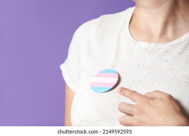 Unrecognizable Person Wearing And Pointing A Trans Flag Badge Or Pin. Concepts Of Identity Pride, Gender Diversity, Equality And Non Discrimination.