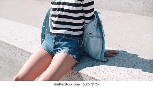 girl in short denim shorts