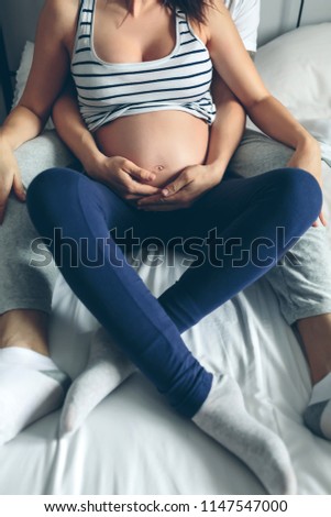 Similar – Pregnant woman embraced by her husband