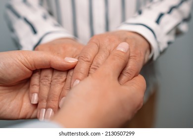 Unrecognizable Senior And Young Holding Hands S For Comfort And Sympathy. Strong Connection Confidential Conversation