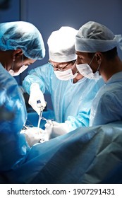 Unrecognizable surgeon performing operation, operation theater, surgery