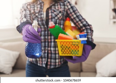 Unrecognizable woman with cleaning equipment ready to clean house. Professional cleaning service concept, copy space - Shutterstock ID 1040678659