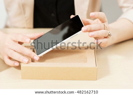 Similar – Image, Stock Photo Unrecognizable woman packing carton box with tape dispenser
