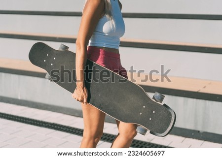 Similar – Surfer woman with bikini and wetsuit holding surfboard