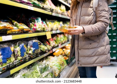 Unrecognizable Woman In Supermarket Buying Vegetables And Reading Their Nutritional Information