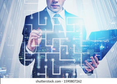 Unrecognizable Young Businessman Working With Digital Maze In Night City. Concept Of Challenging Task And Technology. Toned Image Double Exposure