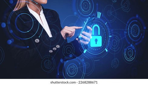 Unrecognizable young businesswoman using smartphone over dark blue background with double exposure of blurry cryptocurrency interface. Concept of data protection