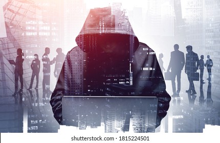 Unrecognizable young hacker in hoodie using laptop in blurry city. Business people. Concept of cybersecurity. Toned image double expsoure - Powered by Shutterstock