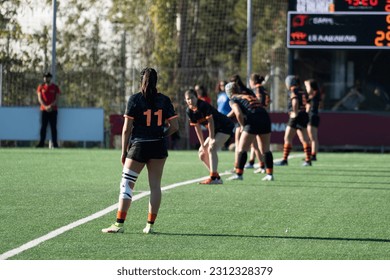 unrecognizable youth players in rugby tournament, young girls from back - Powered by Shutterstock