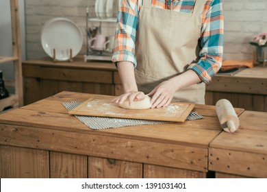 Unrecognized Asian Teenage Girl Baking Cake For Mom In Kitchen At Home On Mothers Day. Female Hands Kneading Dough Making Bread For Boyfriend Birthday. Woman Wife Prepared Handmade Cookie On Easter.