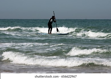 unrecognized surfer in the waves