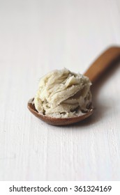 Unrefined Raw Shea Butter On Wooden Background