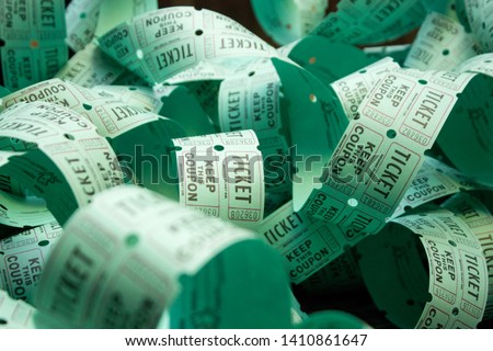 unrolled roll of green raffle tickets