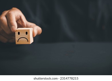 Unsatisfied customer expressing dissatisfaction on a wooden block. Concept of bad product quality, low rating, and negative comment. The impact of unsatisfied customers on business reputation. - Shutterstock ID 2314778215
