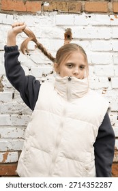 Unscripted moment capturing girl exploring different hair styling options