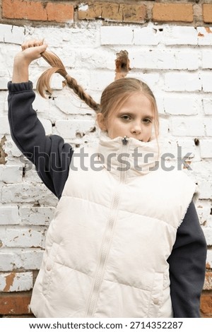 Unscripted moment capturing girl exploring different hair styling options