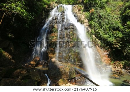 Unseen waterfall with rainbow in south Thailand, CHaloem Phrakiat Rama 9 waterfall (lower part) in Betong, Yala province
