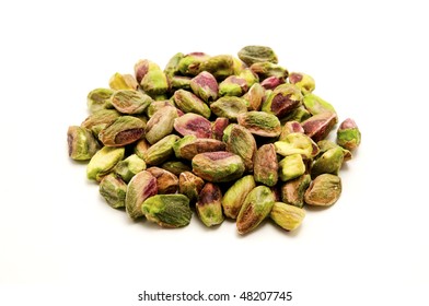 Unshelled roasted pistachios on a white background - Powered by Shutterstock