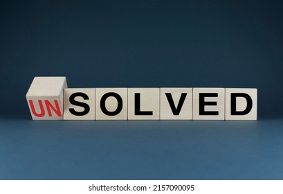 Unsolved or solved. Cubes form the choice words Unsolved or solved. The concept of Unsolved or solved both in business and in life - Shutterstock ID 2157090095