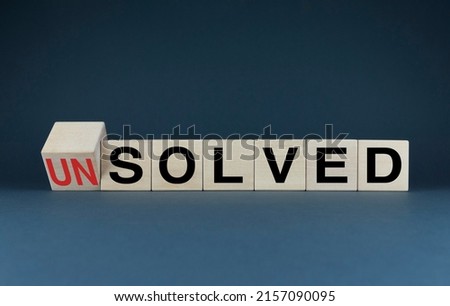 Unsolved or solved. Cubes form the choice words Unsolved or solved. The concept of Unsolved or solved both in business and in life