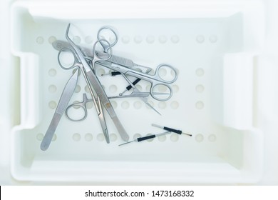 Unsorted Surgical Instruments After Cleaning In The Washing Machine
