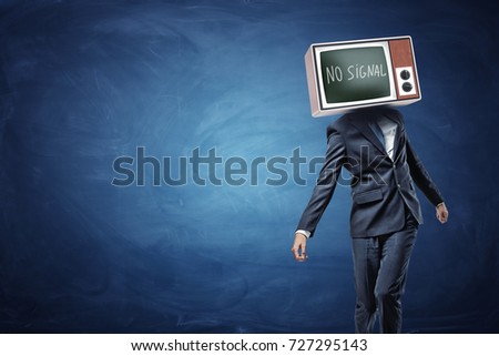 An unsteady businessman on blue background with a TV replacing his head and showing black screen and No Signal writing. No original thoughts. No brainer job. Business manipulation.