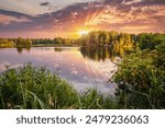 Unsurpassed quiet lake in the morning light surrounded by a forest, tree reflection on the water surface. Location place Small Polissya, Ukraine, Europe. Photo wallpaper. Discover the beauty of earth.